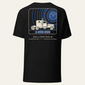 Back of black Million Mile Milestone Tee with a large printed mission-patch style graphic
