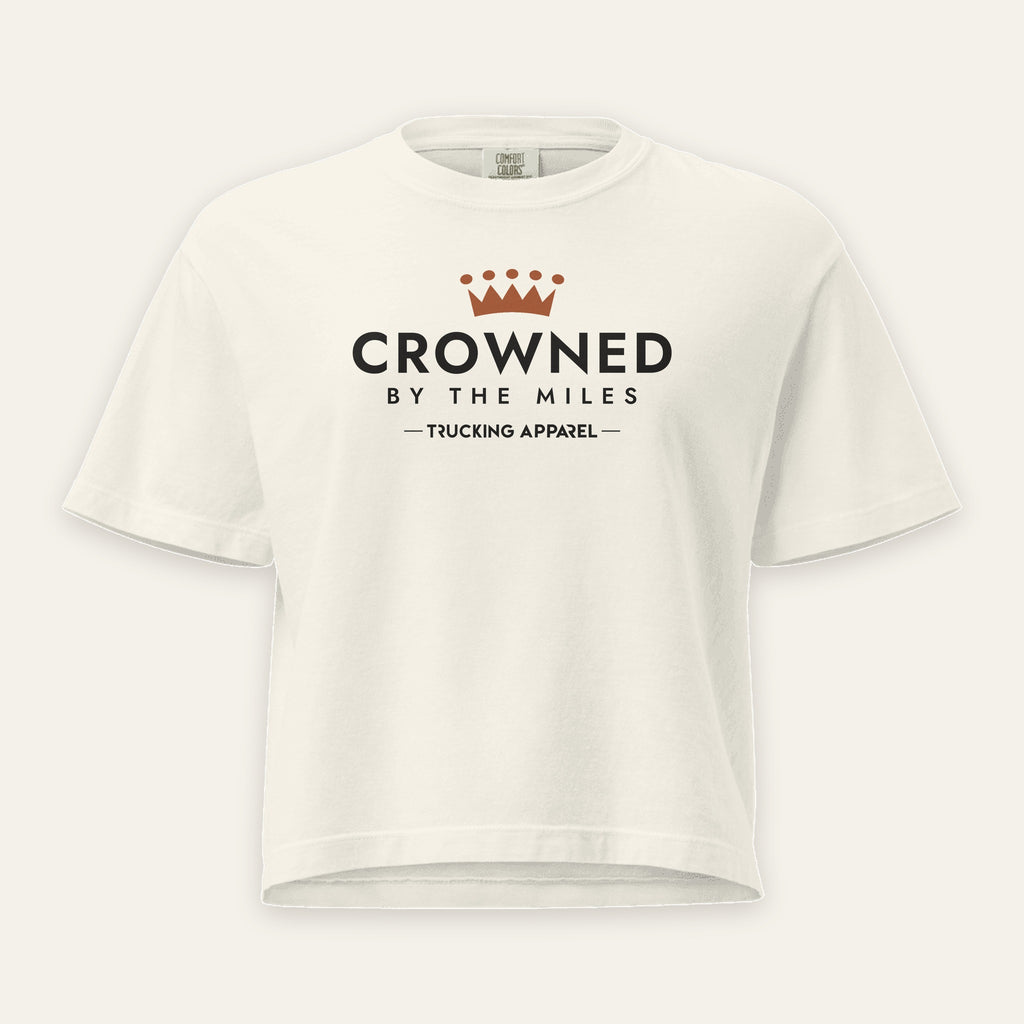 Crowned by the Miles Boxy Tee in Ivory, front view, crown over CROWNED BY THE MILES lettering, on a cream background