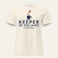 Keeper of the Lanes Dispatcher Tee in Natural, front view, KEEPER OF THE LANES lettering with a coffee cup and route pin, on a cream background