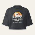 Long Haul Heart Retro Crop Tee in Washed Black, front flat view, semi under a retro sunset with cream lettering