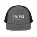 120 PSI Trucker Hat, charcoal and black Richardson 112 mesh-back cap with 120 PSI in white embroidery over a gauge scale with an orange needle, front view