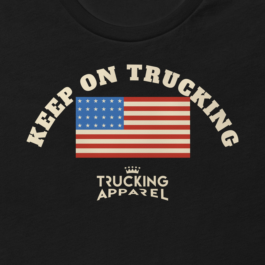 Keep on Trucking Tee, close-up of the arched KEEP ON TRUCKING print over an American flag, with the Trucking Apparel crown logo underneath.