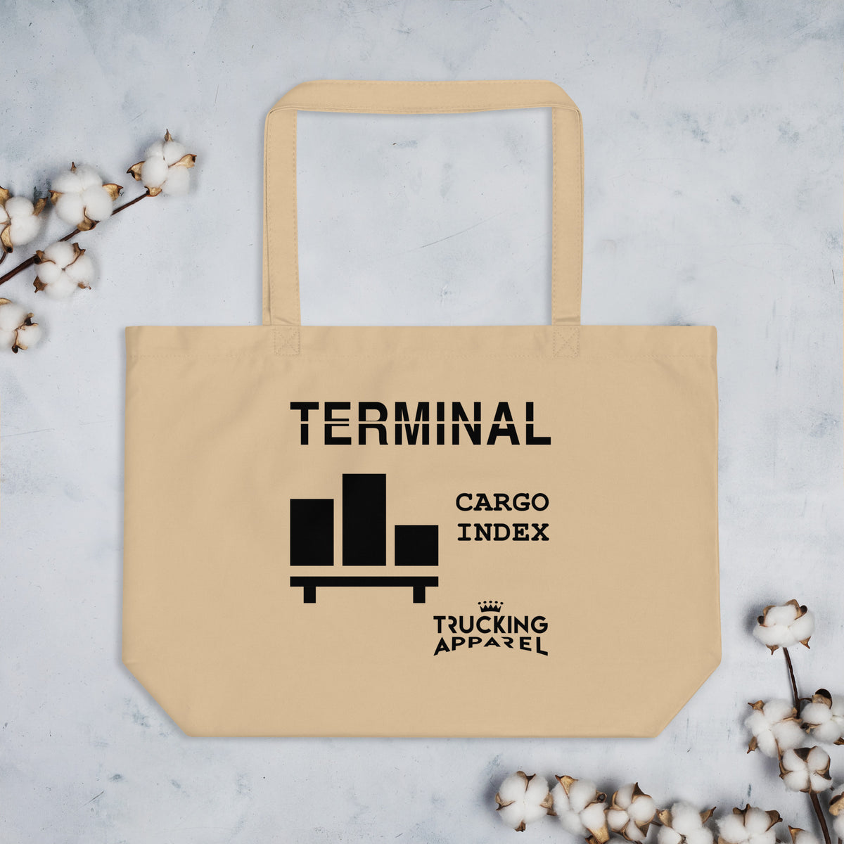 Cargo Index Tote in Oyster with black cargo graphic — styled flat view with cotton props