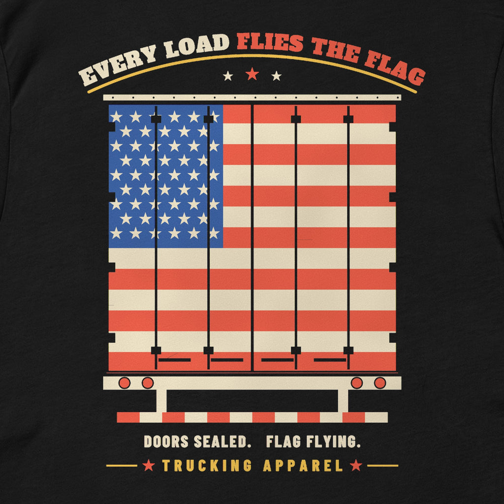Every Load Flies the Flag Tee in black, close-up of the EVERY LOAD FLIES THE FLAG back print: an American flag across a trailer's rear swing doors.