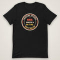 Red, White & On Time Tee in black, front view laid flat showing the large round RED, WHITE & ON TIME seal centred on the chest, ringed by TRUCKING APPAREL and KEEP IT ROLLING.