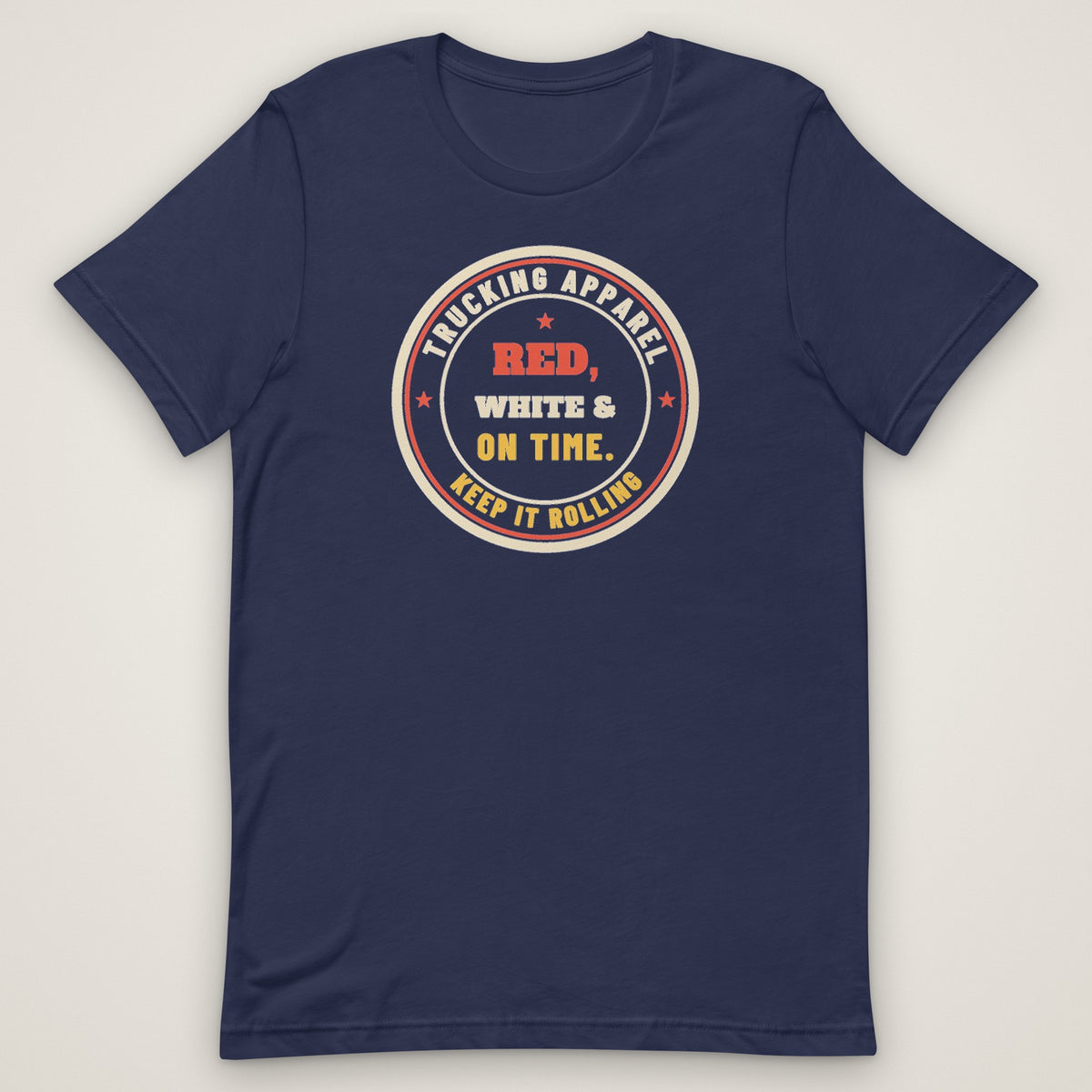Red, White & On Time Tee in navy, front view laid flat showing the large round RED, WHITE & ON TIME seal centred on the chest, ringed by TRUCKING APPAREL and KEEP IT ROLLING.