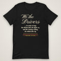 We the Drivers Tee in black, front view laid flat showing the full-front We the Drivers script with the preamble-style lines underneath and the Trucking Apparel signature.