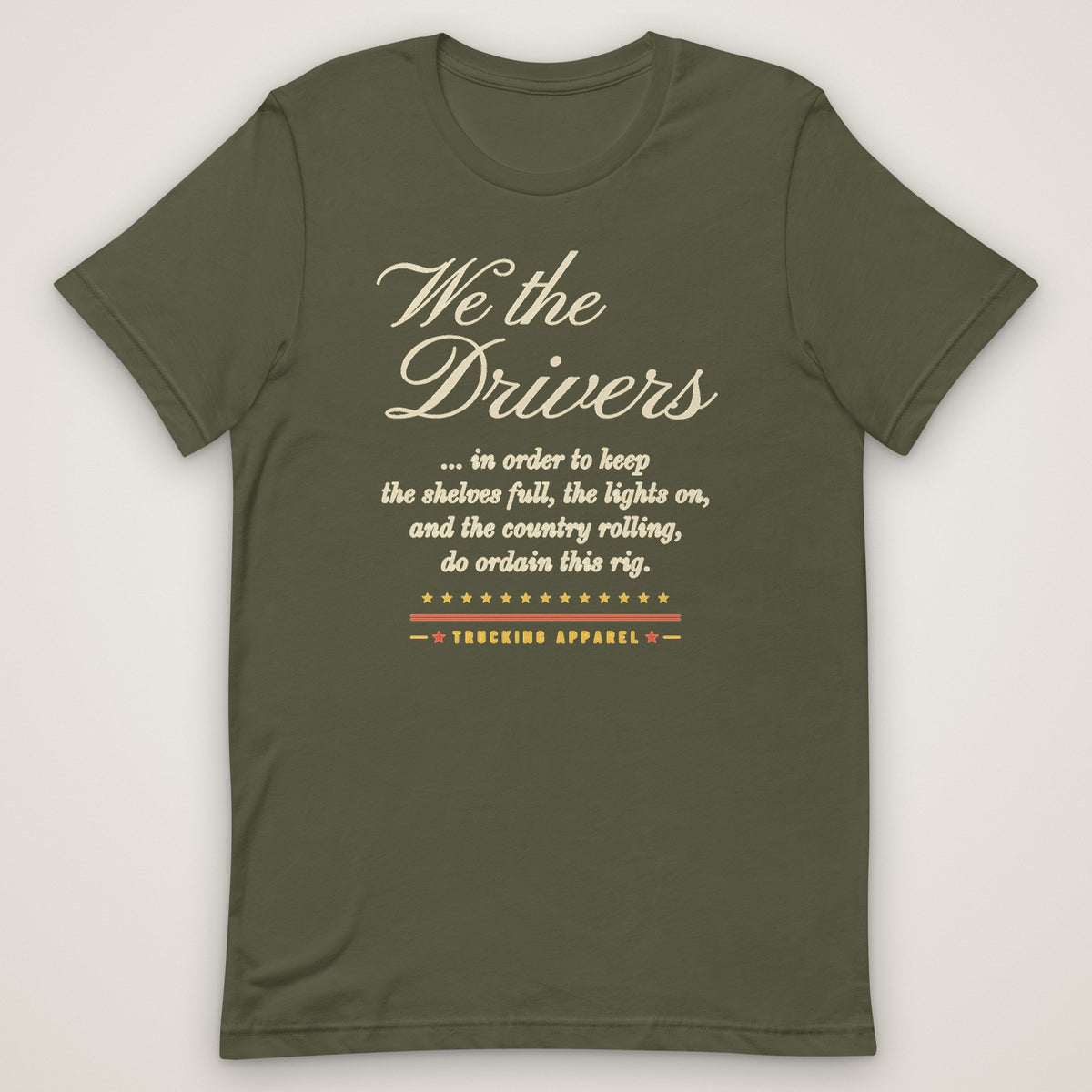 We the Drivers Tee in military green, front view laid flat showing the full-front We the Drivers script with the preamble-style lines underneath and the Trucking Apparel signature.