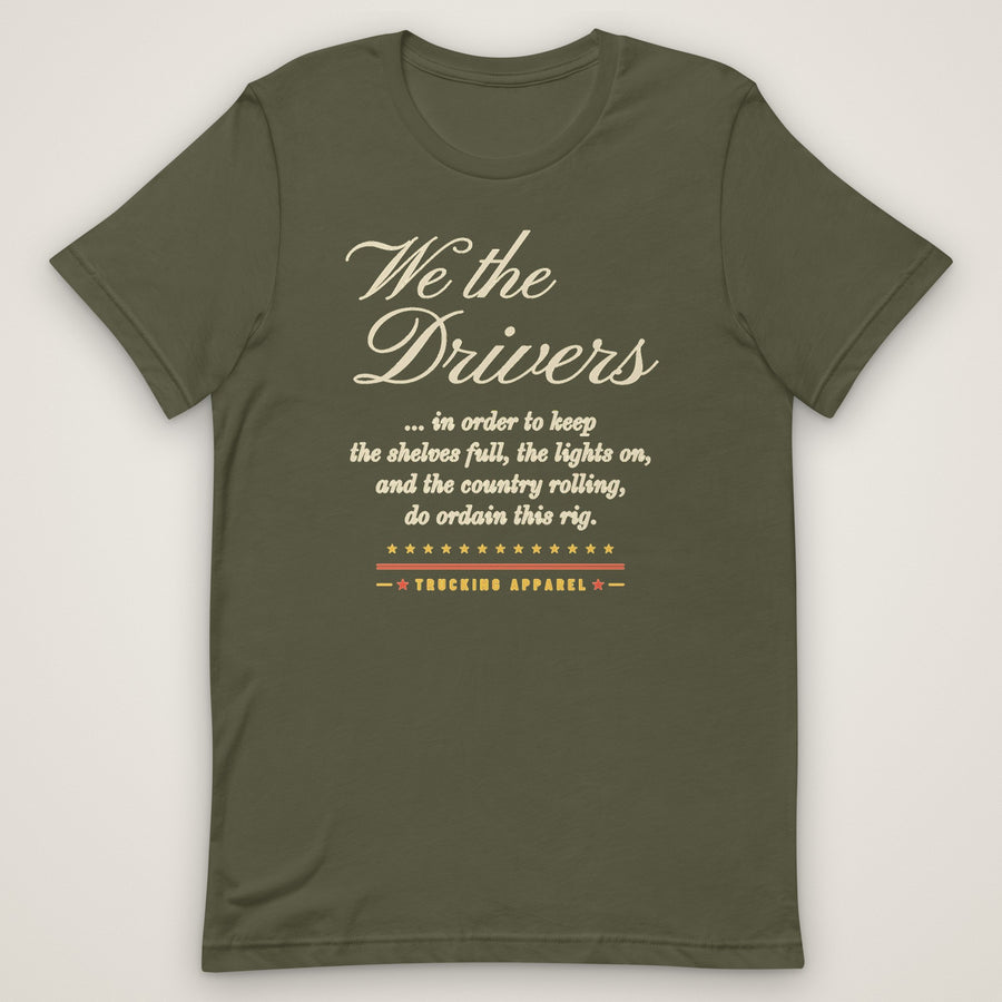 We the Drivers Tee in military green, front view laid flat showing the full-front We the Drivers script with the preamble-style lines underneath and the Trucking Apparel signature.