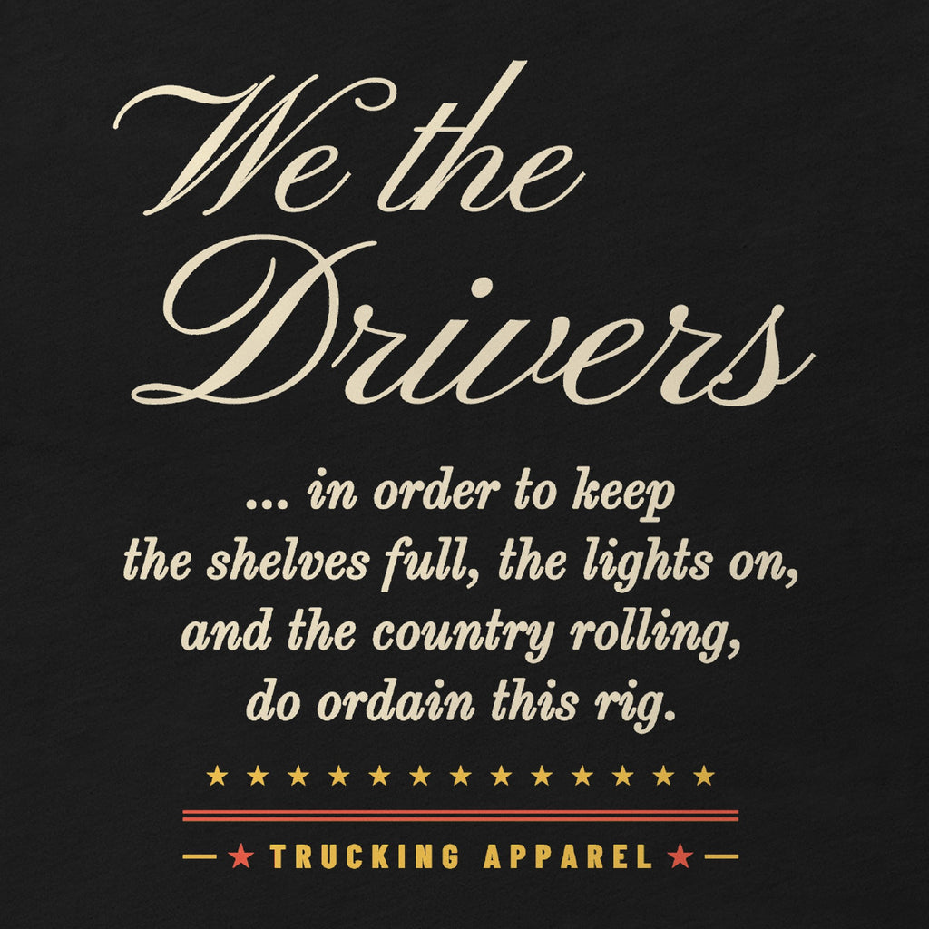 We the Drivers Tee in black, close-up of the full-front We the Drivers script with the preamble-style lines: in order to keep the shelves full, the lights on, and the country rolling, do ordain this rig.