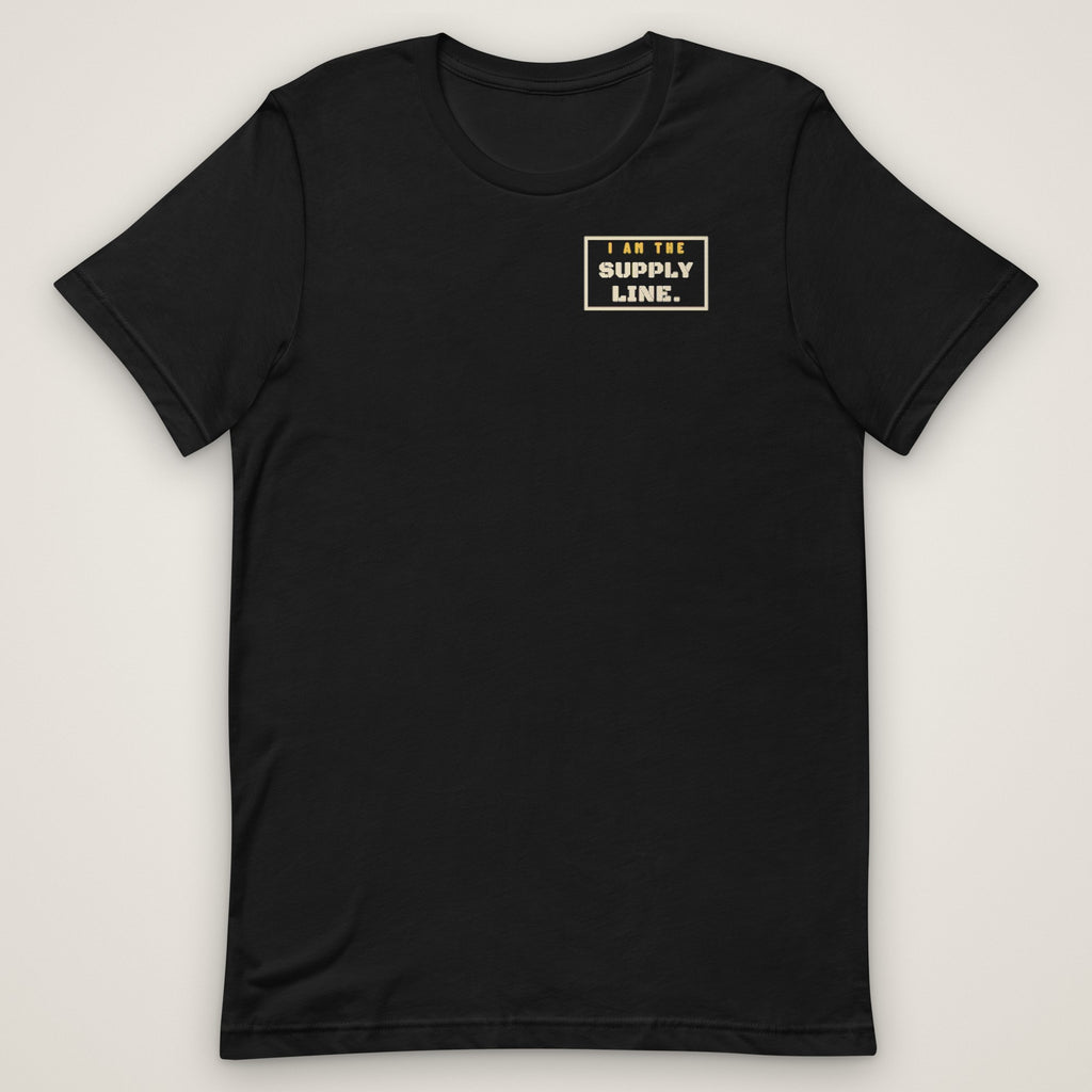 I Am the Supply Line Tee in black, front view laid flat with the bold I AM THE SUPPLY LINE. stencil block on the left chest.
