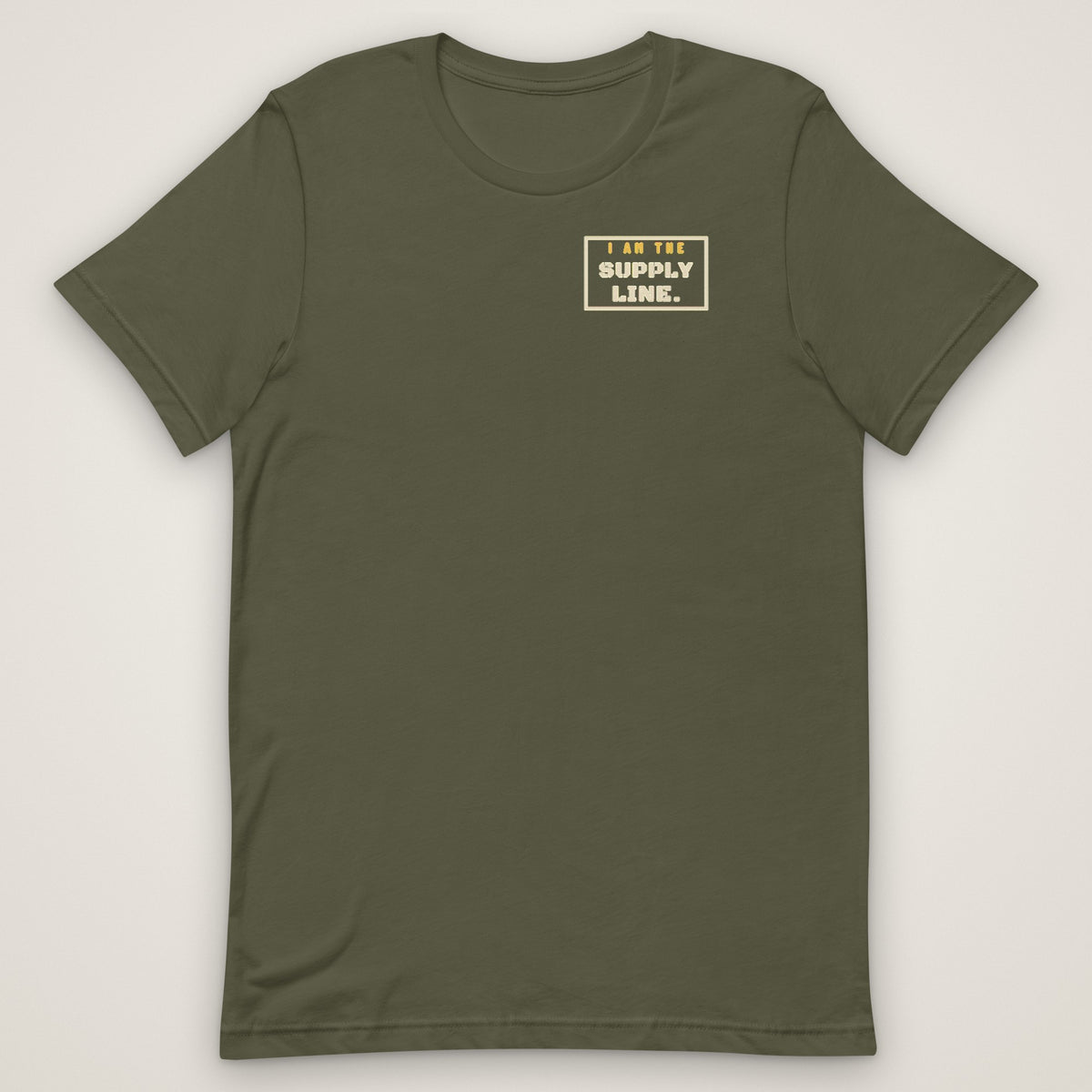 I Am the Supply Line Tee in military green, front view laid flat with the bold I AM THE SUPPLY LINE. stencil block on the left chest.