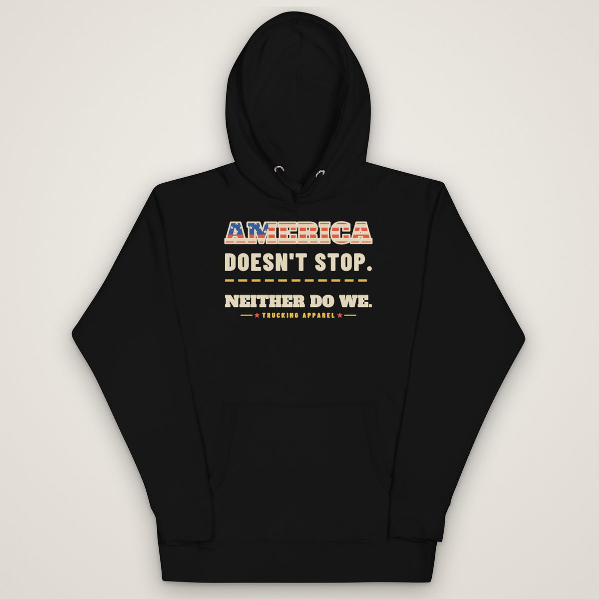 America Doesn't Stop Hoodie in black, front view laid flat showing the AMERICA DOESN'T STOP. NEITHER DO WE. front print with stars-and-stripes lettering.
