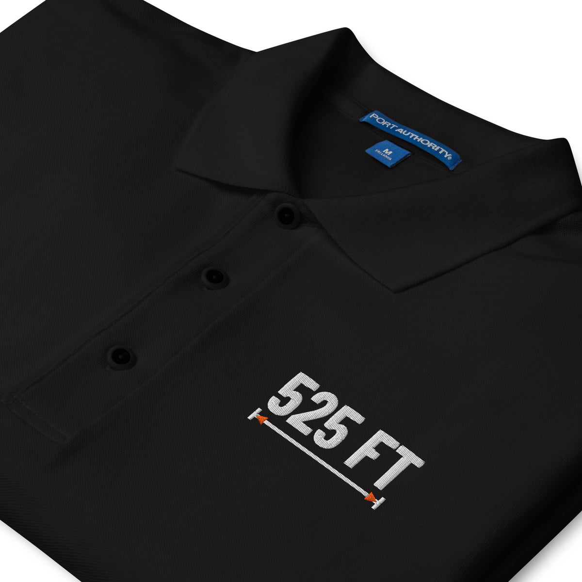 525 FT Polo in black, close-up of the embroidery.