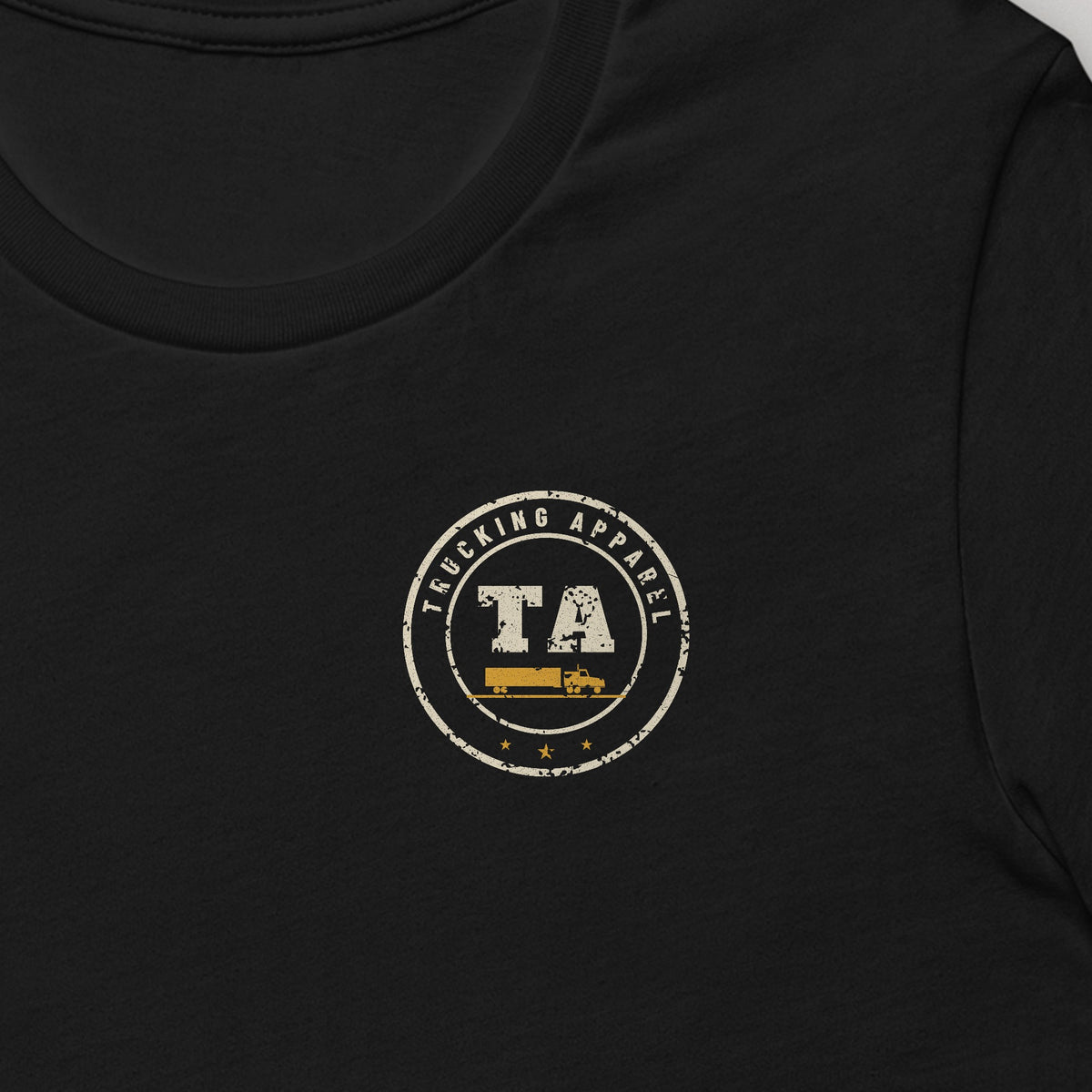 Finding Parking After 9 PM Is an Extreme Sport Trucker Tee in black, close-up of the left-chest Trucking Apparel badge. Design made with AI assistance.