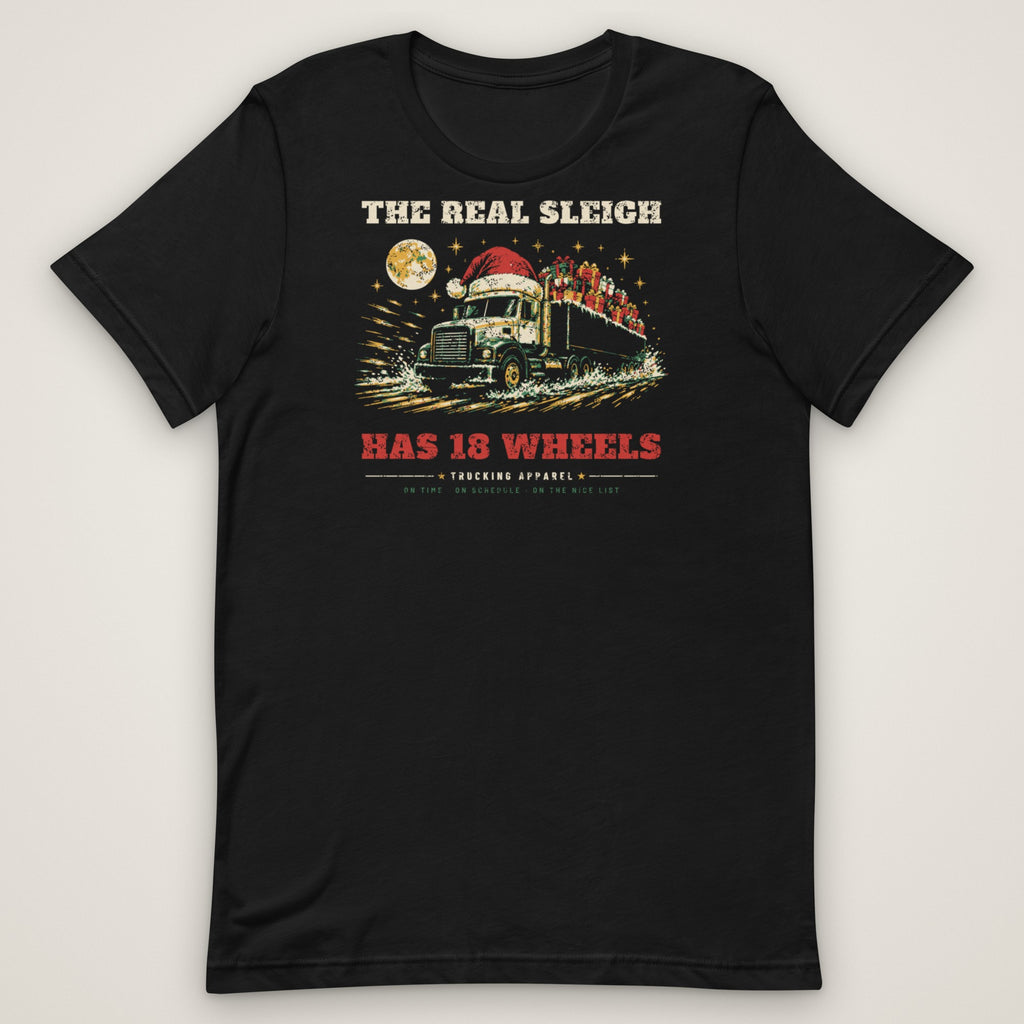The Real Sleigh Has 18 Wheels Christmas Trucker Tee in black, front view laid flat showing the full front print. Design made with AI assistance.