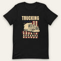 Stars & Stripes Big Rig Tee, front view laid flat showing a tall TRUCKING headline over a big rig on stars and stripes, with APPAREL on a band across the flag.
