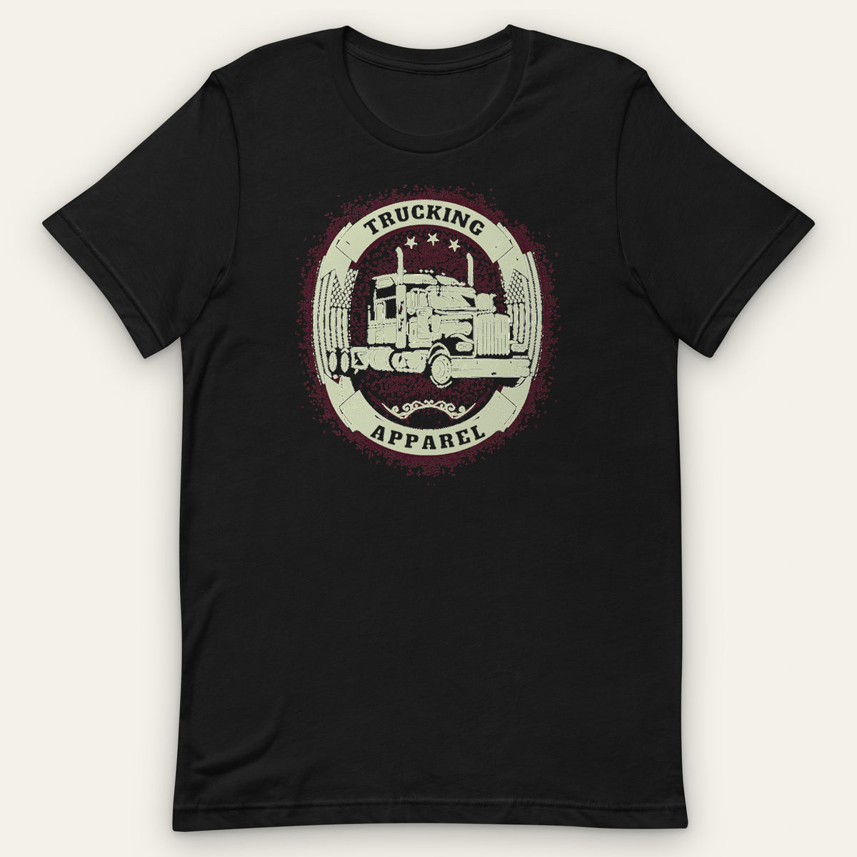 Big Rig Emblem Trucker Tee, front view laid flat showing a cream oval emblem with a big rig, crossed flags and three stars, with TRUCKING and APPAREL on solid bands.