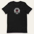 Ruled by an American Trucker Tee, front view laid flat with the winged WILD AND TOUGH, RULED BY AN AMERICAN TRUCKER chest badge and the Trucking Apparel crown logo.