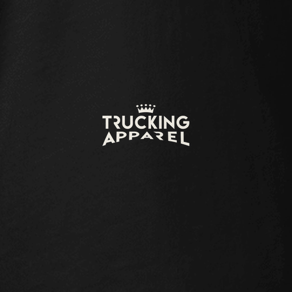 Trucker Mom Tee: My Kid Delivers Christmas in black, close-up of the Trucking Apparel crown logo printed on the left sleeve. Design made with AI assistance.