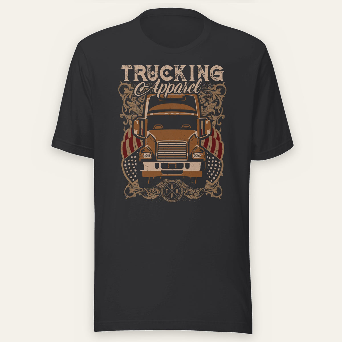 Trucking Cas Tee in black heather, front view laid flat showing an orange vintage big rig under a TRUCKING Apparel script headline with ornate scrollwork and American flag accents.